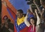 Venezuela's newly elected President Nicolas Maduro and his wife, Attorney General Cilia Flores celebrate after the official results of the presidential elections were announced, at the Miraflores Palace in Caracas, Venezuela, Sunday, April 14, 2013.