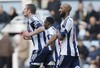 West Bromwich Albion's Nicolas Anelka, right, gestures as he celebrates his goal against West Ham United during their English Premier League soccer match at Upton Park, London, Saturday, Dec. 28, 2013.