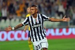 Juventus forward Arturo Vidal, of Chile, celebrates after scoring during a Serie A soccer match between Juventus and Lazio at the Juventus stadium, in Turin, Italy, Saturday, Aug. 31, 2013.