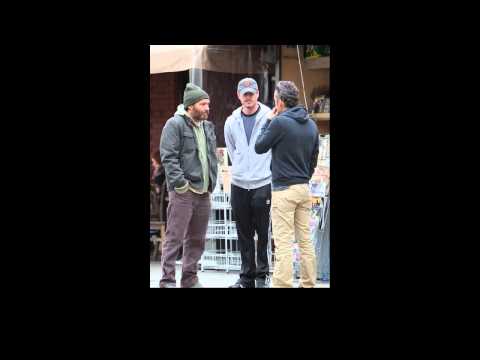 Eric Dane C dressed in casual sports wear and Balthazar Getty R talking to a fri