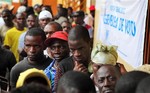 Angolans queue at a voting station in Kicolo, Luanda, Angola to cast their ballots Friday, Aug. 31, 2012.