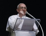 Pope Francis gestures as he delivers his Angelus prayer from the window of his studio overlooking St. Peter's Square, at the Vatican, Sunday, March 17, 2013.