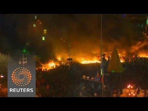 Ukrainian protesters and police light up Kiev's main square with petrol bombs and fireworks