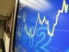  A man walks near a display showing the Hang Seng Index in Hong Kong, China 07 Jun 2010. Hong Kong's Hang Seng dropped 2.36 p...