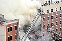 NEW YORK, NY - MARCH 12: Firefighters from the Fire Department of New York (FDNY) respond to a five-alarm fire and building collapse at 1646 Park Ave in the Harlem neighborhood of Manhattan March 12, 2014 in New York City. Reports of an explosion were heard before the collapse of two multiple-dwelling buildings that left at least 17 injured.   Justin Heiman/Getty Images/AFP