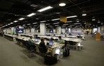 Foreign journalists use Internet services provided at the Main Press Center at the Olympic Green in Beijing, Tuesday, July 29, 2008. After months of promising the Internet will be uncensored for journalists during the Beijing Olympics, the IOC delivered a stark clarification on Tuesday, many Internet sites will be blocked under controls applied by China's communist government. The blocked Internet is the latest broken promise on press freedom at the Beijing Olympics, which China's authoritarian government is hoping will show off an open, modern country and the rising political and economic power of the 21st cent