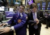 Specialist Frank Masiello, left, directs trades at his post on the floor of the New York Stock Exchange, Monday, Nov. 1, 2010.