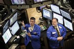 Traders work on the floor of the New York Stock Exchange Thursday, July 23, 2009 in New York