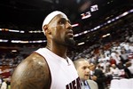 FILE - In this May 9, 2012, file photo, Miami Heat forward LeBron James leaves the court after defeating the New York Knicks 106-94 in an NBA basketball game in the first round of the Eastern Conference playoffs in Miami. The Heat won the series 4-1 to advance to the second round. James is the NBA's MVP for a third time, putting him alongside some of the game's all-time greats. A person familiar with the decision told The Associated Press that James will be announced Saturday, May 12, as this year's winner of the league's top individual honor, and that he'll be formally presented with the trophy by Commissioner David Stern on Sunday afternoon before Miami hosts Indiana in Game 1 of an Eastern Conference semifinal series. (AP Photo/Wilfredo Lee, File)