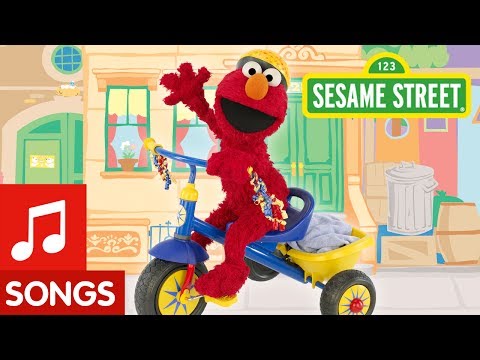 Sesame Street: Elmo Riding A Tricycle