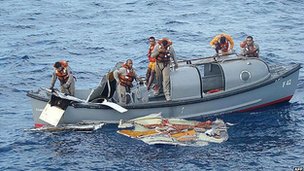 Members of the Brazilian Frigate Constituicao recovering debris in June 2009