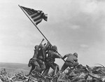 File - U.S. Marines of the 28th Regiment, 5th Division, raise the American flag atop Mt. Suribachi, Iwo Jima, on Feb. 23, 1945.