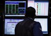 Traders work on the floor at the New York Stock Exchange in New York, Tuesday, March 16, 2010