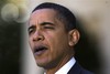 President Barack Obama speaks in the Rose Garden of the White House about health care reform and Iraq's new electoral law after returning from Camp David Sunday, Nov. 8, 2009, in Washington.