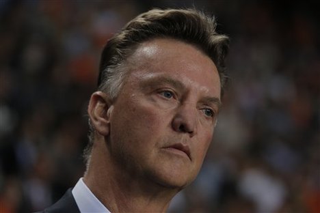 Coach Louis van Gaal watches the Dutch players warm up prior to the 2014 World Cup Group D qualifying soccer match Netherlands against Turkey at Amsterdam ArenA, Netherlands, Friday, Sept. 7, 2012.