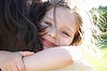 Mother and daughter embracing