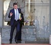 French interior minister Manuel Valls leaves the Elysee Palace following the weekly cabinet meeting in Paris, Wednesday Sept. 25, 2013. The French government has declared the economic crisis over and is promising that its budget for next year will bring growth and jobs, but experts are criticizing the proposal from all sides and a true rebound looks way off.