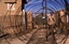 File-  KANDAHAR, Afghanistan - A guard stands watch outside the front gate of the detention center here December 24, 2001. Marines with the 15th and 26th Marine Expeditionary Unit (Special Operations Capable) team with a U.S. Army detachment of military police 