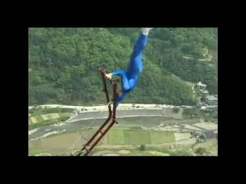 Daredevil hangs over canyon in China's Hunan province