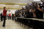 Dilma Rousseff, presidential candidate for the governing Workers Party, gestures to photographers after voting in Brazil's presidential election runoff in Porto Alegre, Brazil, Sunday Oct. 31, 2010.