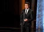 Zac Efron speaks on stage during the Oscars at the Dolby Theatre on Sunday, March 2, 2014, in Los Angeles.