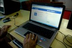 A Kashmiri youth reads a news item posted on his Facebook page in an Internet cafe in Srinagar, India, Saturday, Aug. 28, 2010. With student discussion groups banned and thousands of security operatives believed to be snooping on protesters, a wave of Web-savvy protesters in Indian-controlled Kashmir have begun using social networking to publicize their fight and keep fellow demonstrators energized and focused. The protesters who call themselves 'sangbazan,' or the stone pelters, use Facebook to debate the weekly calendar of protests, discuss ways to hold Kashmiri leaders accountable and trade daily news updates, some of questionable reliability.