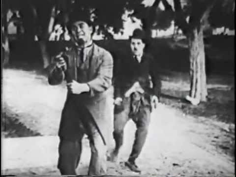 BETWEEN SHOWERS (1914) -- Charlie Chaplin, Ford Sterling, Chester Conklin