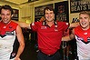 Reason to rejoice: Paul Roos joins his players in singing the club song after Melbourne broke its duck for season 2014.