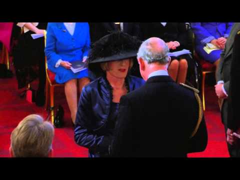 The Prince of Wales presents Grayson Perry with a CBE