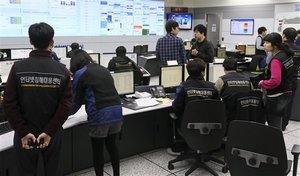 Employees of Korea Internet Security Center work after computer networks at two major South Korean banks and three top TV broadcasters went into shutdown mode en masse, at a monitoring room in Seoul, South Korea, Wednesday, March 20, 2013.