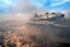 In this photo released on Sunday, April 13, 2014 by the Syrian official news agency SANA, a Syrian forces tank arrives to take position during clashes with Syrian rebels, near the town of Rankous, Syria.