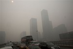 Vehicles clog a highway during a hazy day in Beijing, China, Wednesday, Feb. 26, 2014.