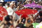 Pope Francis waves to faithful as he arrives for a Mass in St. Peter's Square at the Vatican, Sunday, June 16, 2013. The pontiff greeted hundreds of Harley Davidson riders and blessed their motorcycles prior to the start of the mass. The riders are gathered in Rome for a four-day event to celebrate the motorcycle company's 110th anniversary.