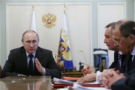 Russian President Vladimir Putin speaks at a Cabinet meeting in the Novo-Ogaryovo residence outside Moscow, Wednesday, April 9, 2014.