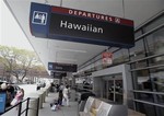 People make their way into Terminal A at Mineta San Jose International Airport near the Hawaiian Airlines gates Monday, April 21, 2014