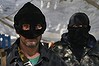 Masked pro Russian militants stand guard at the barricades in Slaviansk.