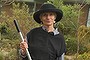 Diane Cummins in her garden, home to native flora as well as chooks and various wildlife.