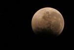 The Earth casts its shadow across the moon's surface during a lunar eclipse in Rafah, in the southern of Gaza Strip on Dec. 10, 2011. This is the second total lunar eclipse of the year and the last until 2014. Photo by AHMED DEEB/ WN