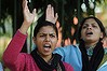 Indian women shout slogans during a protest.