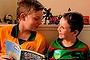 (L TO R) Max Atkinson 9, Will Atkinson 7 and Tommy Atkinson 5 reading 'Captain Underpants' novels at their home in Waverton. 24th April, 2014. Photo: Kate Geraghty