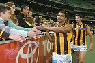 Cyril Rioli high-fives supporters after the game.