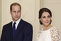 Catherine, the Duchess of Cambridge (R) and Britain's Prince William listen to an address by Governor General Peter Cosgrove during a reception hosted by the Cosgrove and his wife at Government House in Canberra on April 24, 2014.  Britain's Prince William, his wife Kate and their son Prince George are on a three-week tour of New Zealand and Australia.    AFP PHOTO / POOL        (Photo credit should read Stefan Postles/AFP/Getty Images)