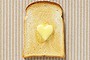 Slice of bread with heart shaped butter