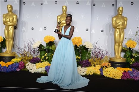 Lupita Nyong'o poses in the press room with the award for best actress in a supporting role for "12 Years a Slave" during the Oscars at the Dolby Theatre on Sunday, March 2, 2014, in Los Angeles.