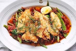 Crumbed John Dory with braised beans.