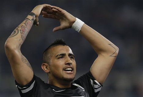 Juventus' Arturo Vidal celebrates after scoring during a Serie A soccer match between Lazio and Juventus in Rome, Monday, April 15, 2013.