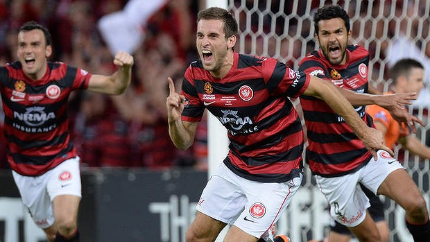 Timley strike: Matthew Spiranovic celebrates his goal for the Wanderers.