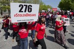 Protestors march in front of the Nigerian embassy in northwest Washington, Tuesday, May 6, 2014, protesting the kidnapping of nearly 300 teenage schoolgirls, abducted from a school in the remote northeast of Nigeria three weeks ago.