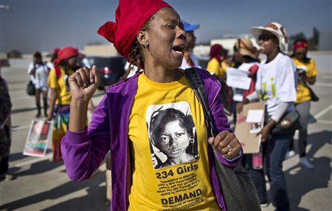 South Africans protest in solidarity against the abduction three weeks ago of hundreds of schoolgirls in Nigeria by the Muslim extremist group Boko Haram and what protesters said was the failure of the Nigerian government and international community to rescue them, during a march to the Nigerian Consulate in Johannesburg, South Africa Thursday, May 8, 2014.