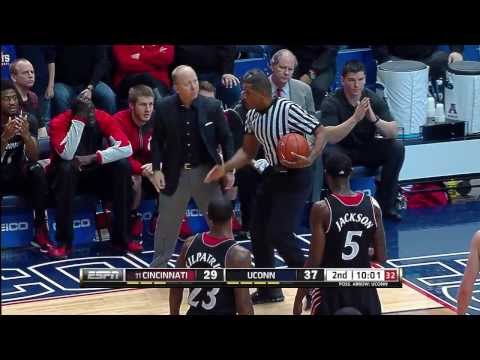 Cincinnati Coach Mick Cronin Restrained by Players